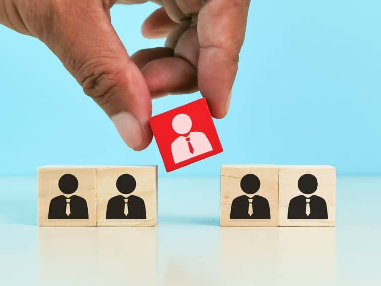 choosing good employee leader. Man choose and take wooden cube.